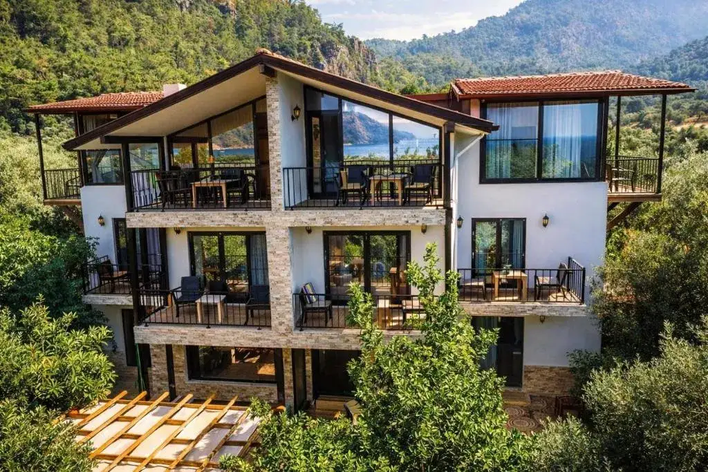 Sayfiye Butik Otel outdoor swimming pool and sun loungers in Ekincik, Köyceğiz